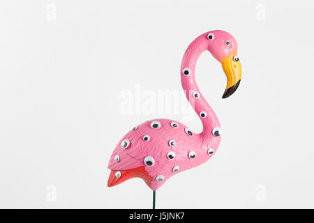 quirky and freak pink plastic flamingo on a pink background with numerous eyes gradient and tones on tones Stock Photo