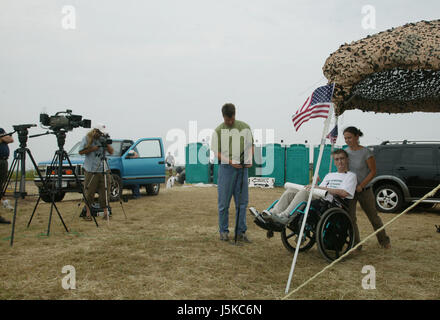 Tomas Young, who was injured on the same day as Casey Sheehan was killed, says he would like to have a meeting with George W. Bush about stem cell research. Young was paralyzed when he was shot while riding in a truck. (Photo by Jeremy Hogan)Protests against George W Bush take place near his home in Crawford, Texas over the summer of 2005. Anti-War activist Cindy Sheehan had begun the protests after her son Casey Sheehan was killed in Iraq during the U.S. invasion. Sheehan demanded that Bush talk to her about the war, and when he didn't, she set up a protest outside his ranch. Stock Photo