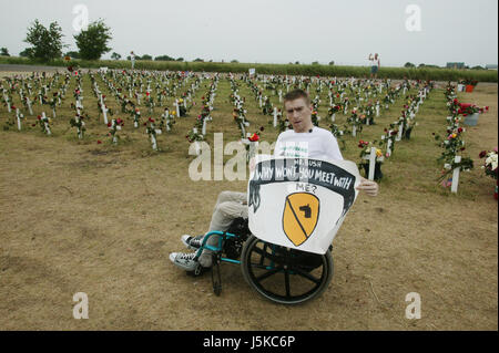 Tomas Young, who was injured on the same day as Casey Sheehan was killed, says he would like to have a meeting with George W. Bush about stem cell research. Young was paralyzed when he was shot while riding in a truck. Protests against George W Bush take place near his home in Crawford, Texas over the summer of 2005. Anti-War activist Cindy Sheehan had begun the protests after her son Casey Sheehan was killed in Iraq during the U.S. invasion. Sheehan demanded that Bush talk to her about the war, and when he didn't, she set up a protest outside his ranch. Stock Photo