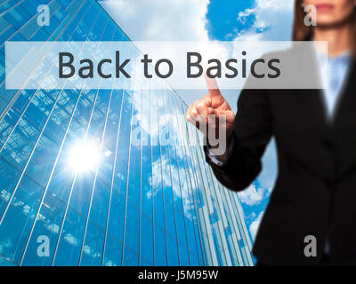 Back to Basics - Businesswoman pressing modern  buttons on a virtual screen. Concept of technology and  internet. Stock Photo Stock Photo