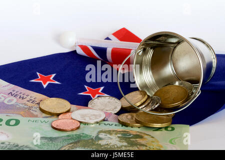 New Zealand money and a bucket. Stock Photo