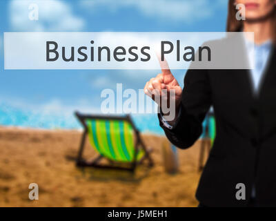 Business Plan - Businesswoman pressing high tech  modern button on a virtual background. Business, technology, internet concept. Stock Photo Stock Photo