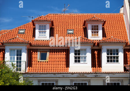 The view of mansard tiled roof with dormer windows in Lisbon. Portugal Stock Photo