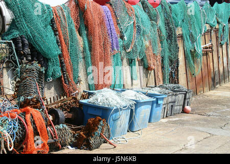 Colored or coloured fishing nets hanging in the sun to dry. Stock Photo