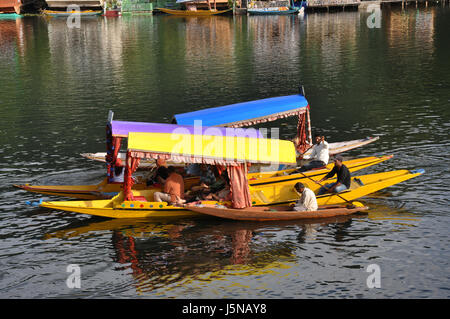 Kashmir, world-famous Dal Lake, A Shikara Ride, Three Shikara with Tourist, House Boat, Scores of shikaras, Dal lake  (© Saji Maramon) Stock Photo