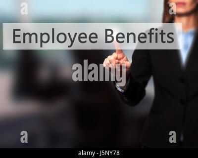Employee Benefits - Businesswoman hand pressing button on touch screen interface. Business, technology, internet concept. Stock Photo Stock Photo