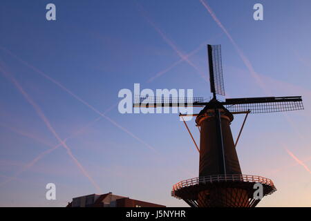 Traditional windmill with blue sky in the background Stock Photo
