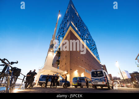 Police guard the Elbphilharmonie concert hall in Hamburg, Germany, 17 May 2017. The G20 summit is to be held from 7 - 8. July in Hamburg. Photo: Daniel Reinhardt/dpa Stock Photo