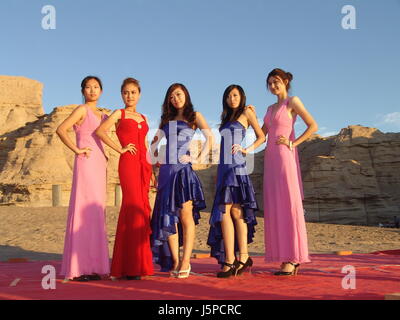 May 12, 2017 - Hami, Hami, China - Hami, CHINA-May 10 2017: (EDITORIAL USE ONLY. CHINA OUT)..Uygur girls promote the local tourism of the Yandan landform in Hami City, northwest China's Xinjiang Uygur Autonomous Region. (Credit Image: © SIPA Asia via ZUMA Wire) Stock Photo