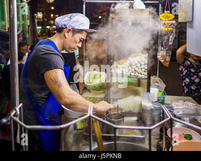 Bangkok, Bangkok, Thailand. 18th May, 2017. A chef makes noodle soups for customers at a street food stall in Bangkok's Chinatown. City officials in Bangkok have taken steps to rein in street food vendors. The steps were originally reported as a ''ban'' on street food, but after an uproar in local and international news outlets, city officials said street food vendors wouldn't be banned but would be regulated, undergo health inspections and be restricted to certain hours on major streets. On Yaowarat Road, in the heart of Bangkok's touristy Chinatown, the city has closed some traffic lanes to Stock Photo