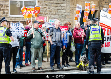Halifax, UK. 18th May, 2017. Demonstrators outside Dean Clough Mills, Halifax, protesting against the launch of the Conservative Party manifesto Halifax, England. 18th May 2017. Credit: Graham Hardy/Alamy Live News Stock Photo