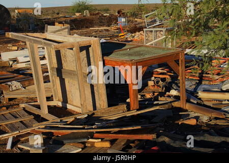 Rubble from a destroyed homestead litter the countryside Stock Photo