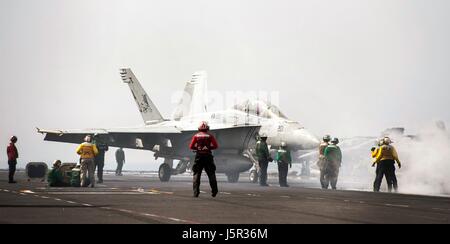 A USN F/A-18F Super Hornet jet fighter aircraft lands on the flight deck aboard the USN Nimitz-class aircraft carrier USS George H.W. Bush May 7, 2017 in the Arabian Gulf.    (photo by Christopher Gaines /US Navy  via Planetpix ) Stock Photo