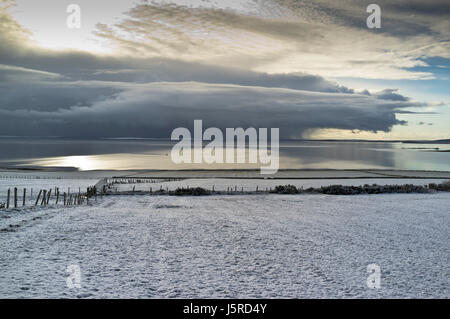 dh Scapa Flow ORPHIR ORKNEY Snow field uk winter scene calm scotland beautiful landscape sky Stock Photo
