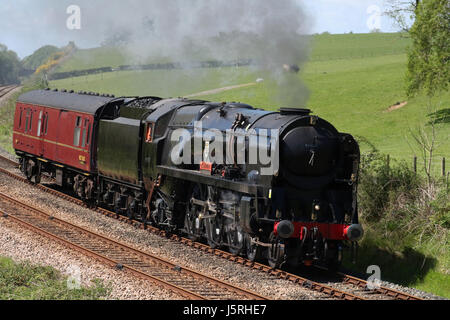 Restored Merchant Navy class steam locomotive 35018 British India Line on a light test run passing Starricks farm near Borwick, Lancashire, England. Stock Photo