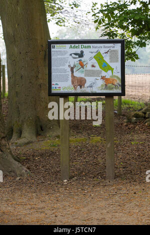 Sign at the entrance to Adel Dam Nature Reserve. Adel Dam is in North Leeds adjacent to Golden Acre Park and is managed by the Yorkshire Wildlife Trus Stock Photo