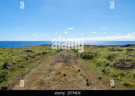 Dirt Road leading to the ocean - Easter Island, Chile Stock Photo