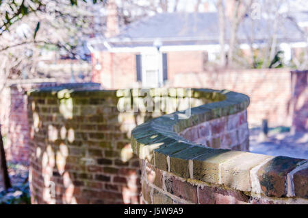 Charlottesville, USA - February 27, 2014: Thomas Jefferson's one brick thick curved crinkle crankle, crinkum crankum, serpentine, ribbon or wavy wall  Stock Photo