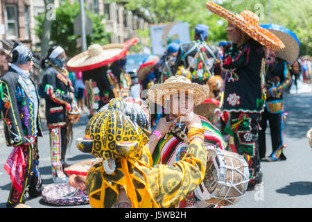 Folk dancers prepare to perform in the Cinco de Mayo Parade in the Sunset Park neighborhood in Brooklyn in New York on Sunday, May 14, 2017. The holiday commemorates a victory of Mexican forces led by General Ignacio Zaragoza Seguín over French forces in the Battle of Puebla on May 5, 1862. In the United States Mexican-Americans celebrate with parades and festivals as a show of ethnic pride.  (© Richard B. Levine) Stock Photo