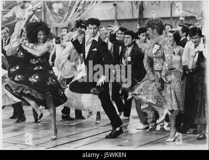 John Travolta, Eve Arden and Cast on-set of the Film, 'Grease', 1978 Stock Photo
