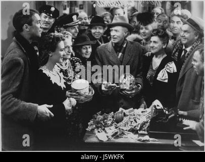 Frank Faylen, H. B. Warner, Beulah Bondi, Donna Reed, James Stewart, Lillian Randolph, Thomas Mitchell, on-set of the Film, “It's a Wonderful Life”, 1946 Stock Photo
