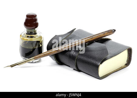 old fashioned diary with dib pen and inkwell isolated on white background Stock Photo