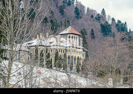 The Cantacuzino Palace (Palatul Cantacuzino) from Busteni, Romania, winter time with snow and ice. Stock Photo