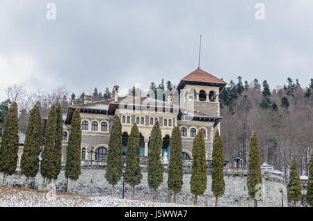 The Cantacuzino Palace (Palatul Cantacuzino) from Busteni, Romania, winter time with snow and ice. Stock Photo