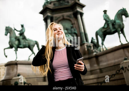 young woman walking down the street in Vienna, Austria Stock Photo