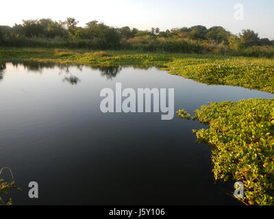 This image depicts the construction of a riprap slope protection along ...