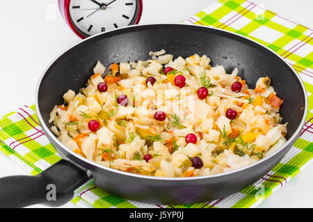 Stewed cabbage in frying pan with vegetables. Studio Photo Stock Photo