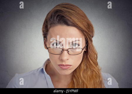 Skepticism. Angry grumpy doubtful woman looking at you camera isolated on grey wall background. Negative human emotion facial expression feeling body  Stock Photo