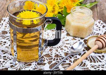 Herbal tea and honey from dandelions on wooden background. Studio Photo Stock Photo