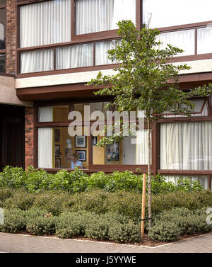 Exterior view looking into flat conversion. Baylis Old school, London, United Kingdom. Architect: Conran and Partners, 1960. Stock Photo