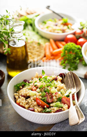 Pearl couscous salad with fresh vegetables Stock Photo