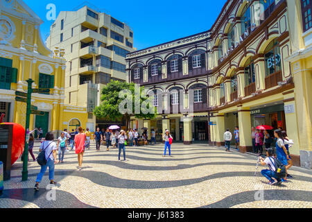 MACAU, CHINA- MAY 11, 2017: An unidentified people walking around of the beautiful St. Dominic Church at Macao. St. Dominic is a medieval church in the old town of Macao Stock Photo