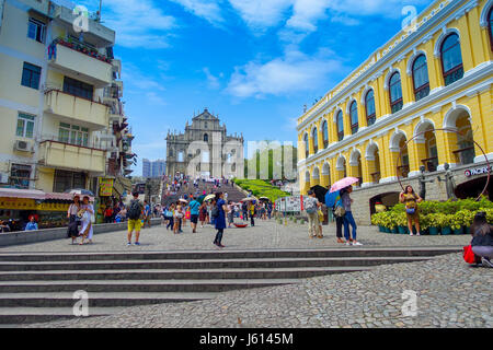 MACAU, CHINA- MAY 11, 2017: An unidentified people walking around of ruins Of Saint Paul's Cathedral, built from 1582 to 1602 by the Jesuits, was destroyed by a fire during a typhoon in 1835 Stock Photo