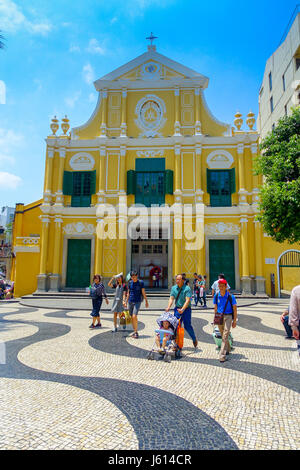 MACAU, CHINA- MAY 11, 2017: An unidentified people walking around of the beautiful St. Dominic Church at Macao. St. Dominic is a medieval church in the old town of Macao Stock Photo