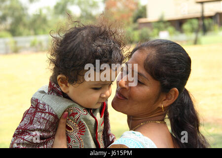 Mother looking at her child with love and affection Stock Photo