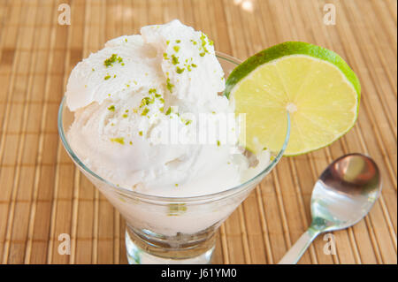 Healthy coconut lime dairy-free ice cream on a bamboo mat Stock Photo