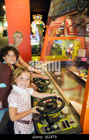 Valparaiso Indiana,Inman's Fun & Party Center,centre,arcade game,race car simulator,steering wheel,girls,teen,teens,play,amusement,fun,IN080720061 Stock Photo