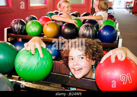 Valparaiso Indiana,Inman's Fun and Party Center,centre,bowling,ten pin bowling balls,green,red,girls,teen,teens,play,amusement,fun,visitors travel tra Stock Photo