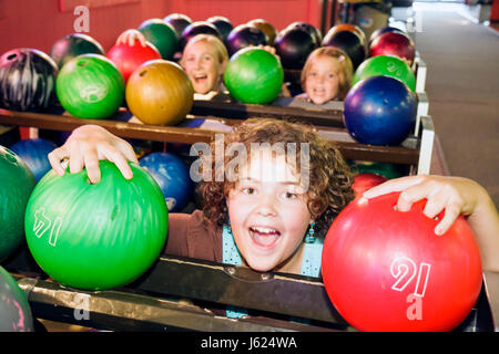 Valparaiso Indiana,Inman's Fun & Party Center,centre,bowling,ten pin bowling balls,green,red,girls,teen,teens,play,amusement,fun,IN080720065 Stock Photo
