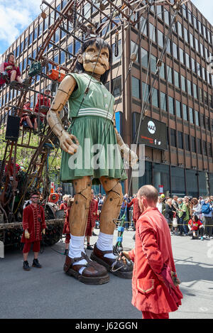 Montreal, Canada. 19th May, 2017. Marionettes as tall as houses march along Montreal streets during 375th birthday bash Credit: Bombaert Patrick/Alamy Live News Stock Photo