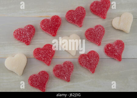 Angled View of Red and White Gummy Hearts Lined Up Stock Photo