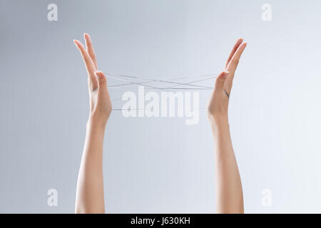 Cat's cradle game Stock Photo