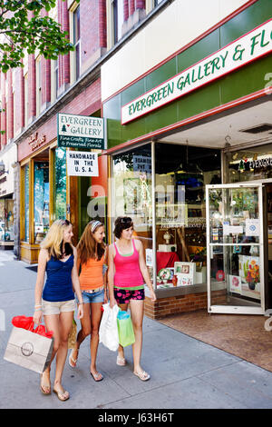 Michigan Traverse City,Front Street,Evergreen Gallery,three girls,teen,teens,shorts,Summer clothes,window shop,storefront,stroll,friends,bags,flip flo Stock Photo