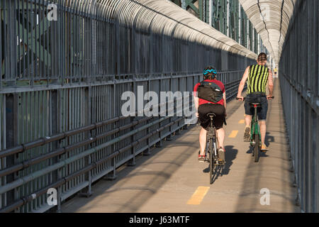 MONTREAL, CA - 18 May 2017: Cyclist on Jacques-Cartier Bridge's multipurpose path Stock Photo