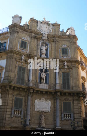 Quattro Canti, officially known as Piazza Vigliena, is Baroque square in Palermo. Facades contain fountains with statues, Spanish king, patronesse Stock Photo