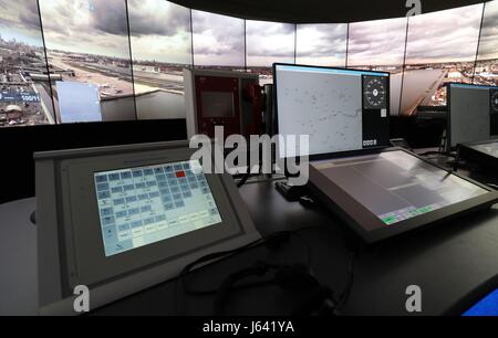 The 225 degree panoramic TV screens and control desk, part of the operations room at National Air Traffic Services (NATS) Swanwick in Hampshire, which will direct aircraft at London City Airport using the UK's first remote digital air traffic control tower. Stock Photo